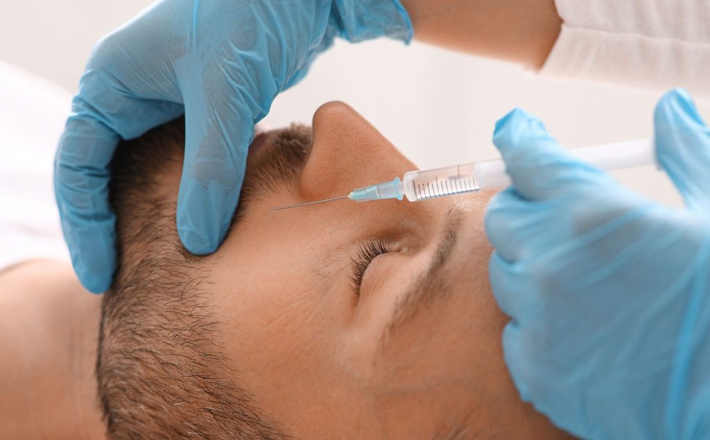 man having dermal filler treatment